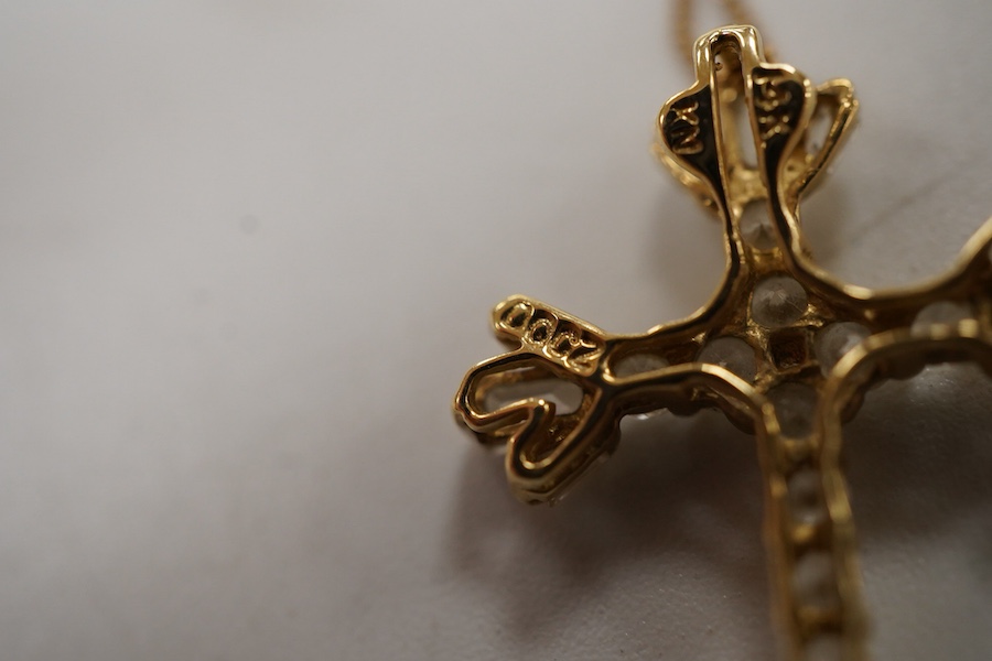 A recent 14k yellow metal and cubic zirconia cluster set cross pendant, 22mm, on a 585 yellow metal fine link chain(knotted).